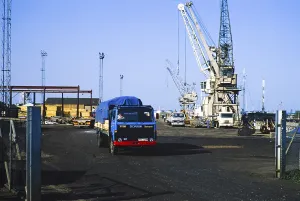 Harbour activity cranes and trucks, Kings Lynn, Norfolk, England, UK 1987