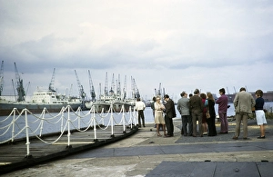 Harbour activity visiting ships in dock, Cardiff Docks, Glamorgan, South Wales, UK 1972 group of people