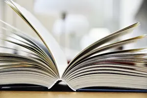 Hardcover book lying on the table in a library