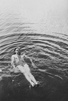 Having fun in the 1930s. A young man is having a swim