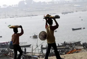 A hawker sells eatables at the confluence of the Ganges