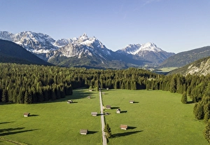 Hay barns in a meadow, Ehrwalder Sonnenspitz and mountains