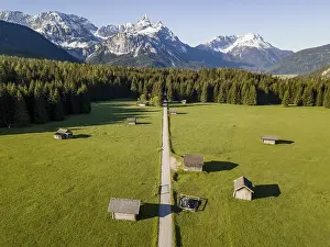 Hay barns in a meadow, Ehrwalder Sonnenspitz and mountains