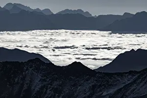 Haze in the valley with South Tyrolean mountains at blue hour