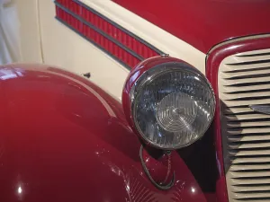 Headlights and bonnet of a red classic car