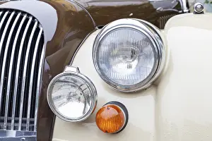 Headlights, indicators and radiator grille of a British sports car from the seventies