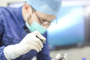 Healthcare professional focusing on tool
