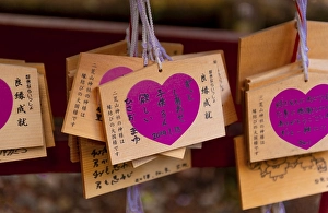 Heart with love message, written wishes to deities on small wooden boards