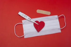 Heart and medical mask as Healthcare concept