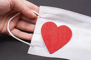 Heart and medical mask as Healthcare concept