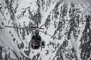 Category Mountain Landscapes Prints: Helicopter in front of snow-covered rock face