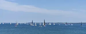 Helsingor, Denmark - 17 June 2021: panorama view of many sailboats sailing on a calm blue ocean