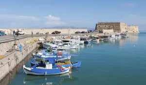 Heraklion, Crete, November 21 2012: The fishing harbour and the castle at herakilion city in Crete island in Greece