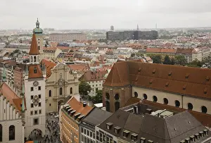 High angle view of buildings with traditional terracotta ceramic tiled rooftops surrounding the Marienplatz Square