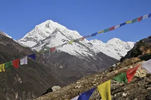 High mountain and prayer flags near Namche Bazaar