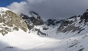 High mountain valley with mountain peak Piz Calderas in winter