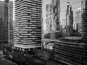 Framed Print : High-rise buildings and distorted reflections on glass in a monochrome setting in Toronto Framed Print : High-rise buildings and distorted reflections on glass in a monochrome setting in Toronto