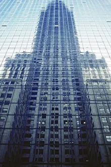 High-rise reflecting into a modern glass front