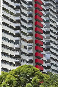 High-rise residential building with balconies and satellite dishes
