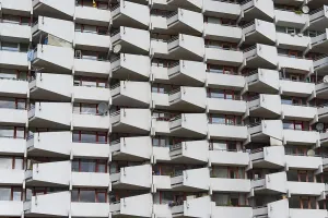 High-rise residential building with balconies and satellite dishes