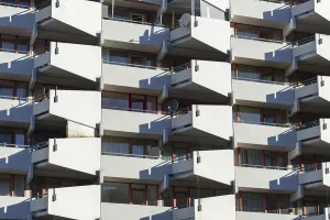 High-rise residential building with balconies and satellite dishes