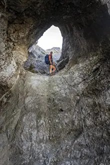 Hiker climbing through the Schindertor