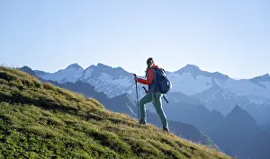 Hiker enjoying the mountain panorama in the morning
