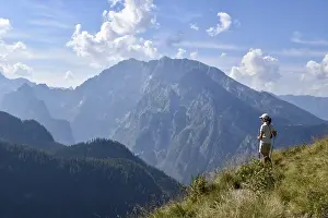 Hiker enjoying the view from the Rossfeldern to the Watzmann