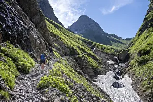 Hiker on a hiking trail, Sperrbach