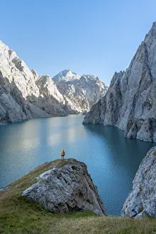 Hiker in front of Kol Suu Mountain Lake
