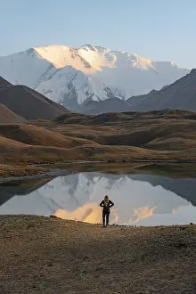 Hiker looking at mountain landscape