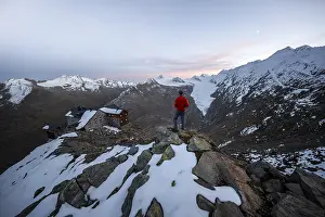 Hiker looking at mountain panorama and glacier