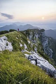 Hiker looking at mountains, Benediktenwand