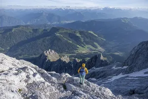 Hiker Looking down into the valley from the Hochkoenig