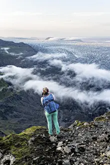 Hiker looks over spectacular landscape