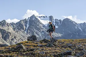 Hiker in a mountain valley in the Tien Shan Mountains
