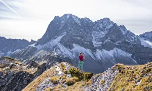 Hiker in the mountains, hike to Hahnkampl