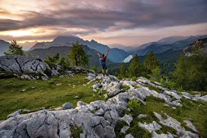 Hiker stretches his arms into the air
