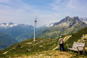Framed Print : Hiker and Wind Turbine and Mountain with Glacier in the Swiss Alps and Against Blue Sky Framed Print : Hiker and Wind Turbine and Mountain with Glacier in the Swiss Alps and Against Blue Sky