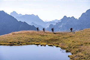 Four hikers on the Carnic High Trail