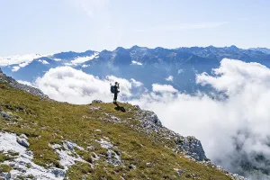 Hikers above the clouds, photographed
