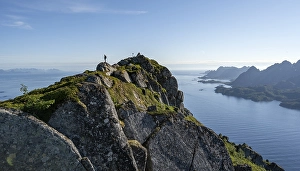 Hikers at the top of Dronningsvarden or Stortinden