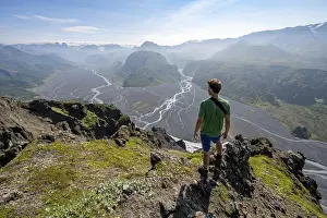 Hikers in front of mountain landscape