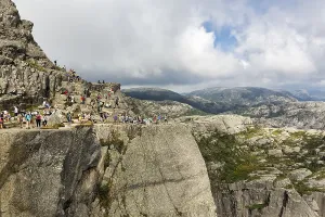 Hikers on rocks, hiking trail to Preikestolen
