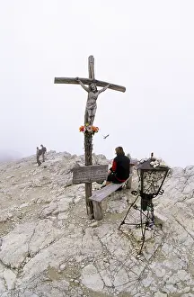 Hikers at the summit cross of Mt