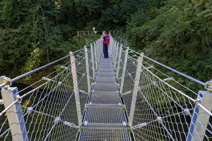 Hikers at the suspension bridge over the Danube