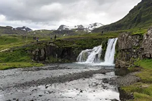Hikers, tourists at Kirkjufellfoss waterfall