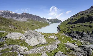 Hiking trail in idyllic mountain landscape with Lac des Dix reservoir