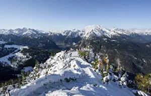 Hiking trail on the snow-covered summit of the Jenner with viewing platform in autumn