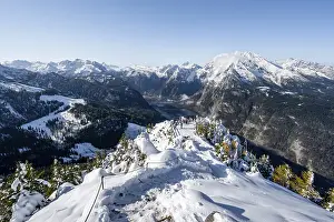 Hiking trail on the snow-covered summit of the Jenner with viewing platform in autumn